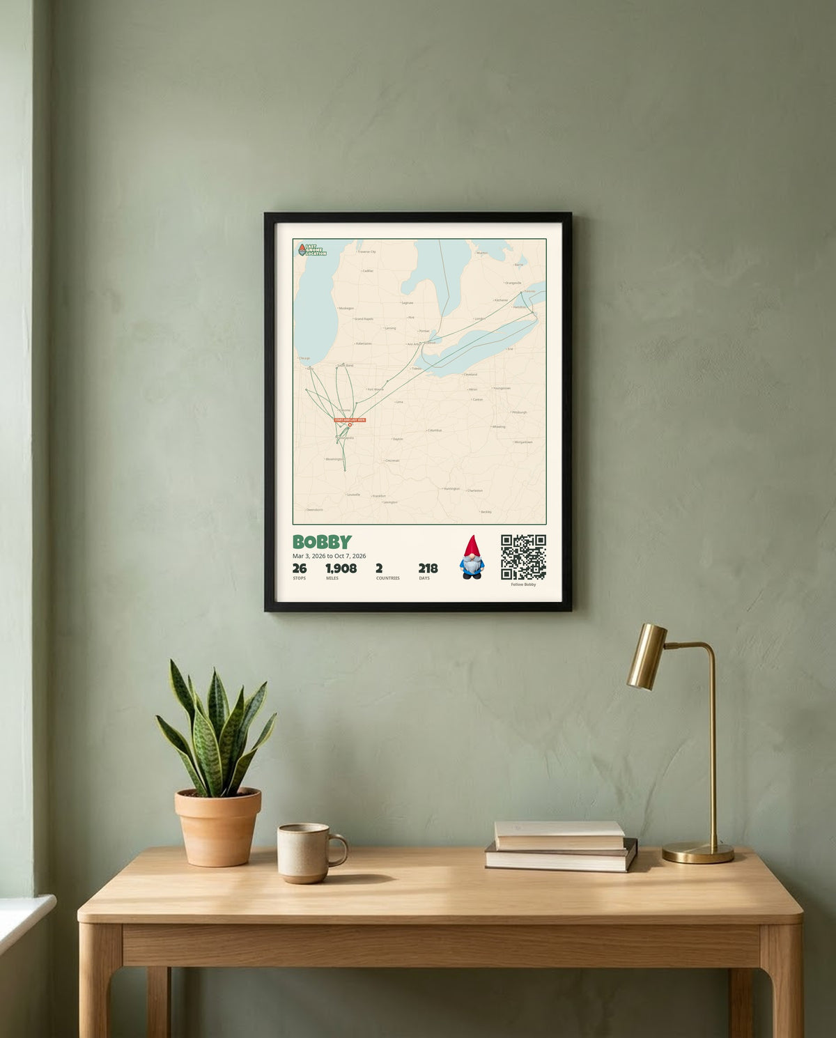 A Gnome Journey Map poster for Bobby in a black frame, hanging above a desk